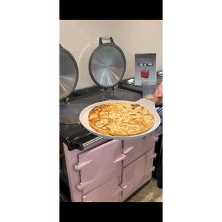 We are cooking pancakes on the Pink Enamelled Cast Iron Heritage Oil Range Cooker