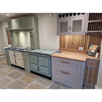 Esse 1000x in sage green and Esse 1000t in cream - both cast iron enamelled electric range cookers